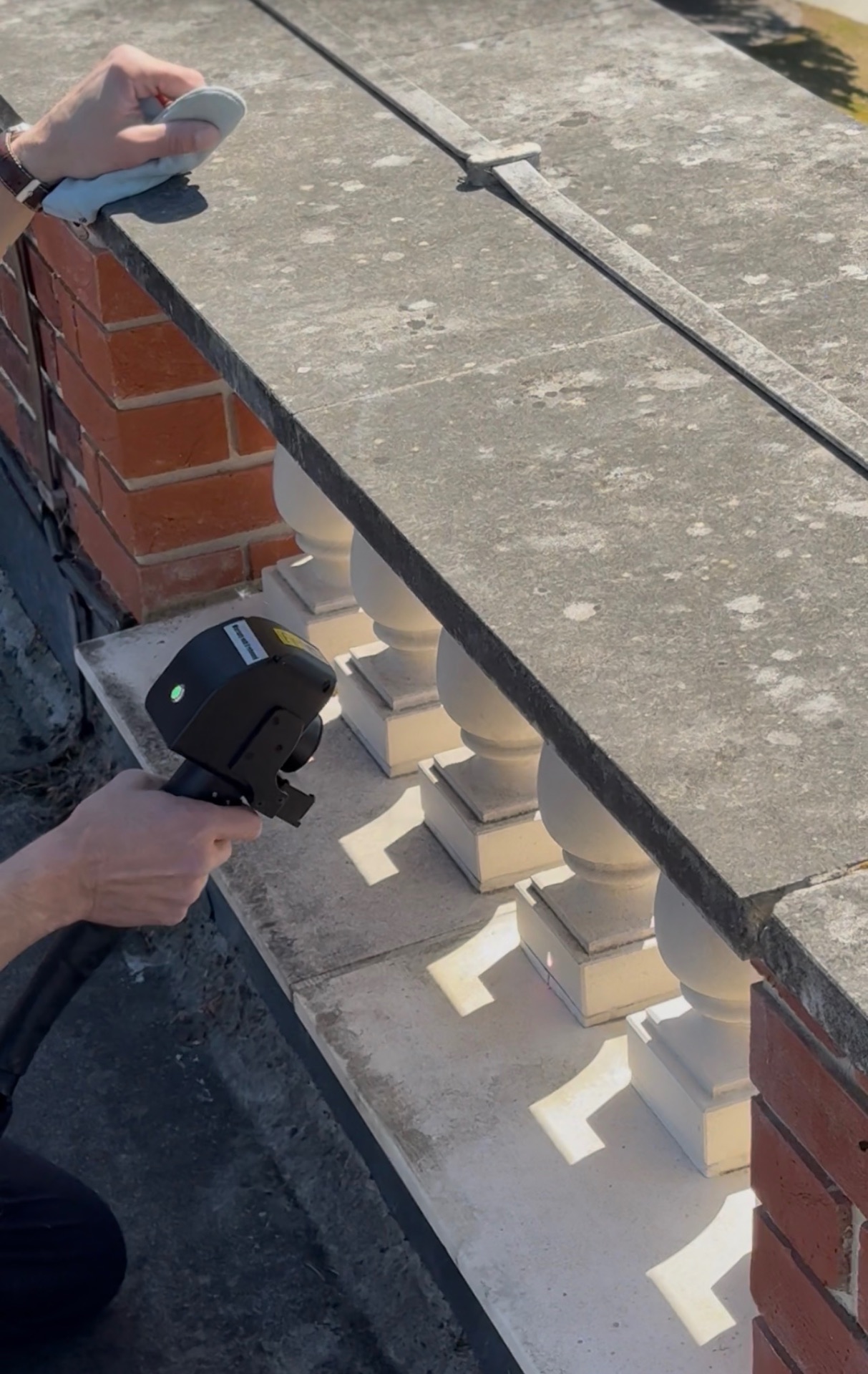 Laser cleaning a stone balustrade on-site